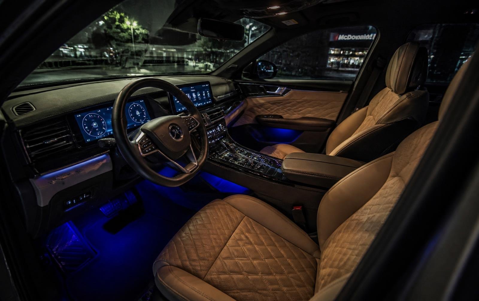 Premium car interior with custom leather seat covers and ambient lighting